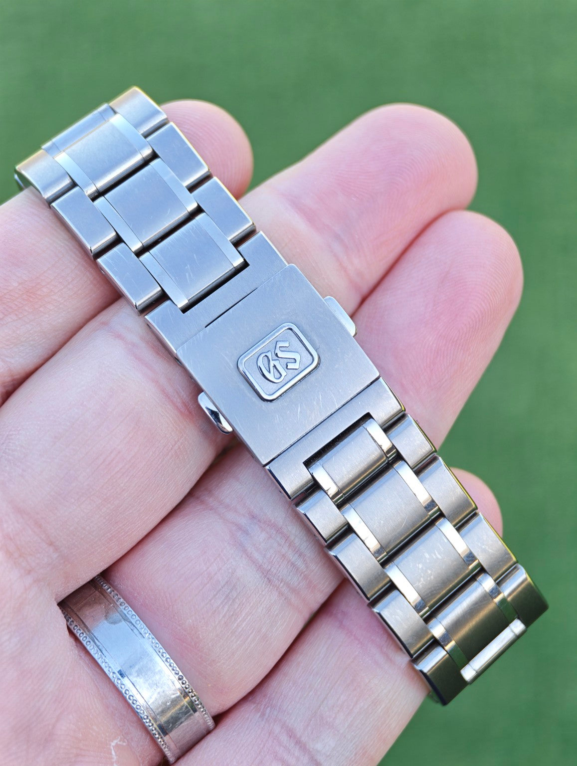 Grand Seiko SBGA259 titanium bracelet and clasp showing normal wear