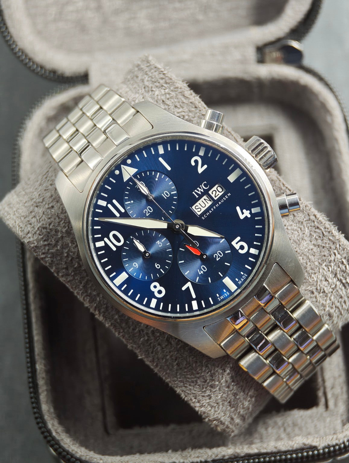 IWC Pilot's Watch Chronograph 41 blue dial on stainless steel bracelet, front view in a grey watch roll