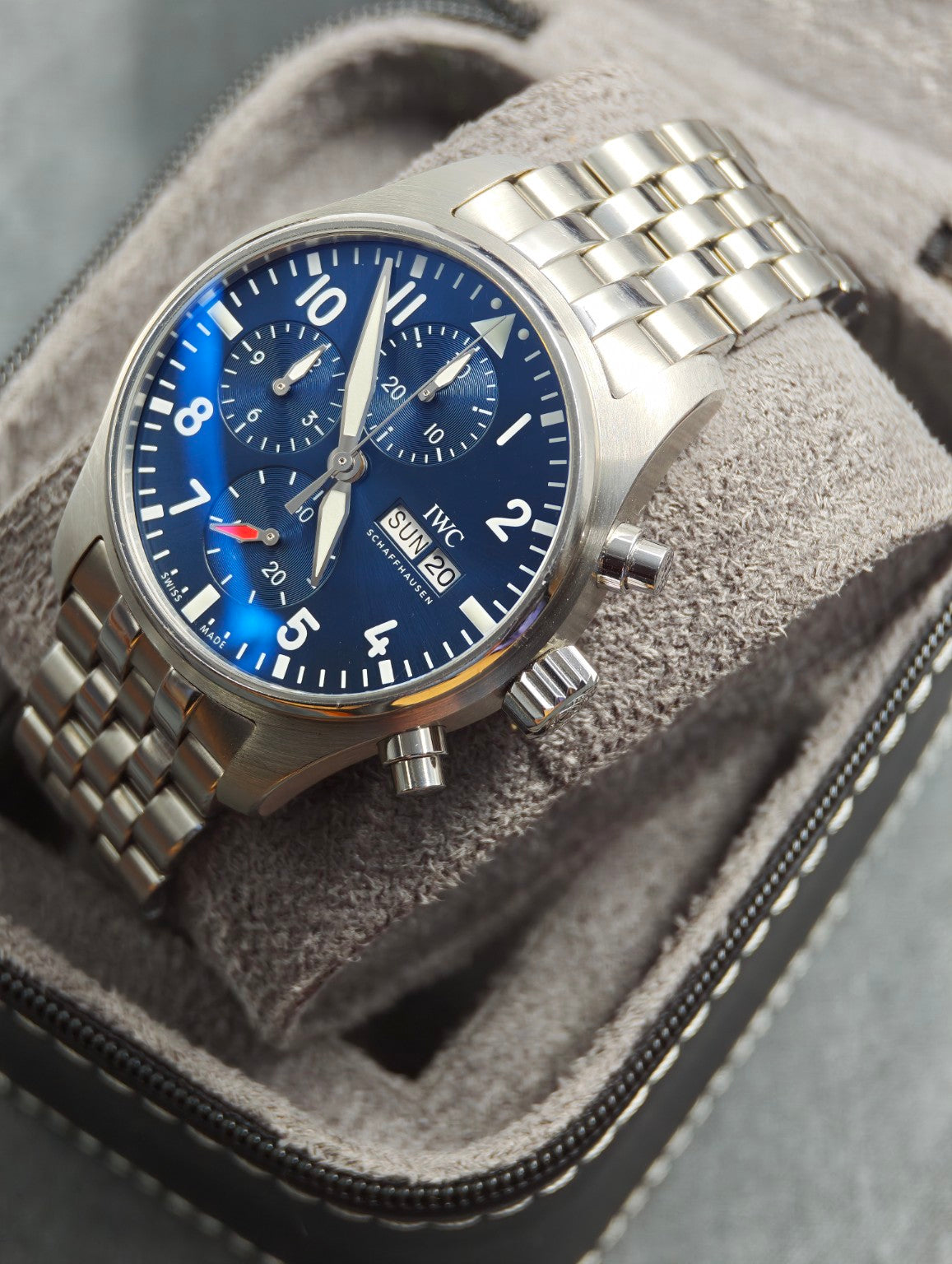 IWC Pilot's Watch Chronograph 41 blue dial and bracelet, angled front view in a grey watch roll