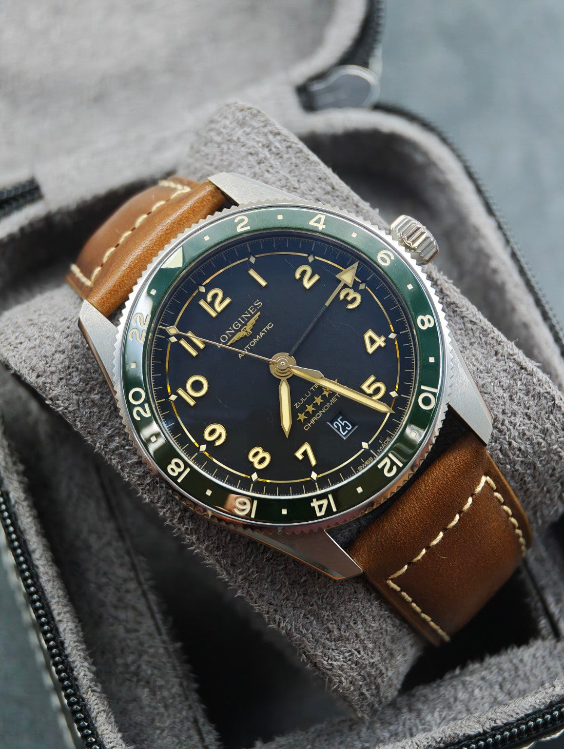 Longines Spirit Zulu Time anthracite dial and green bezel on brown leather strap