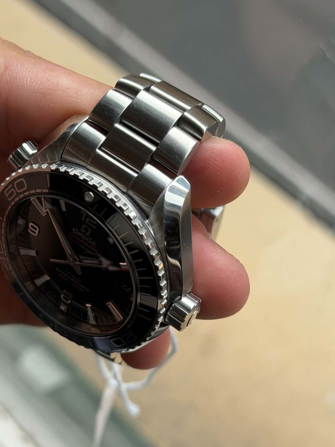 Omega Planet Ocean stainless steel case and crown side