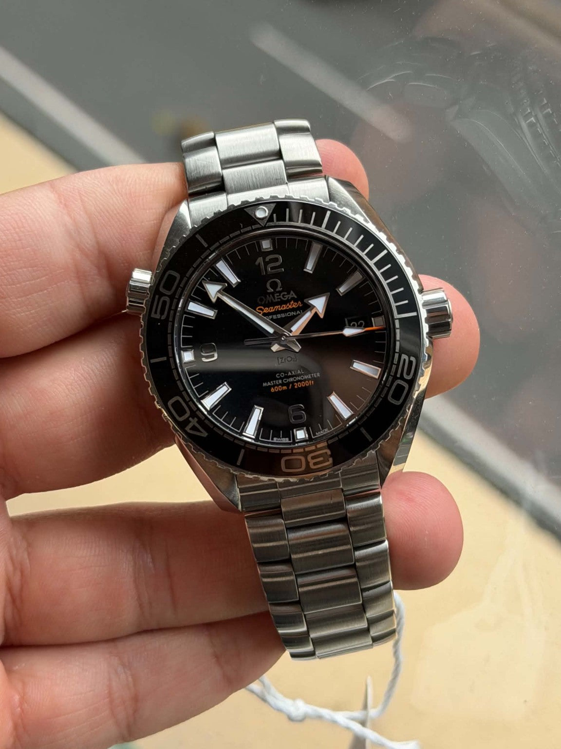 Omega Seamaster Planet Ocean black dial and bezel detail