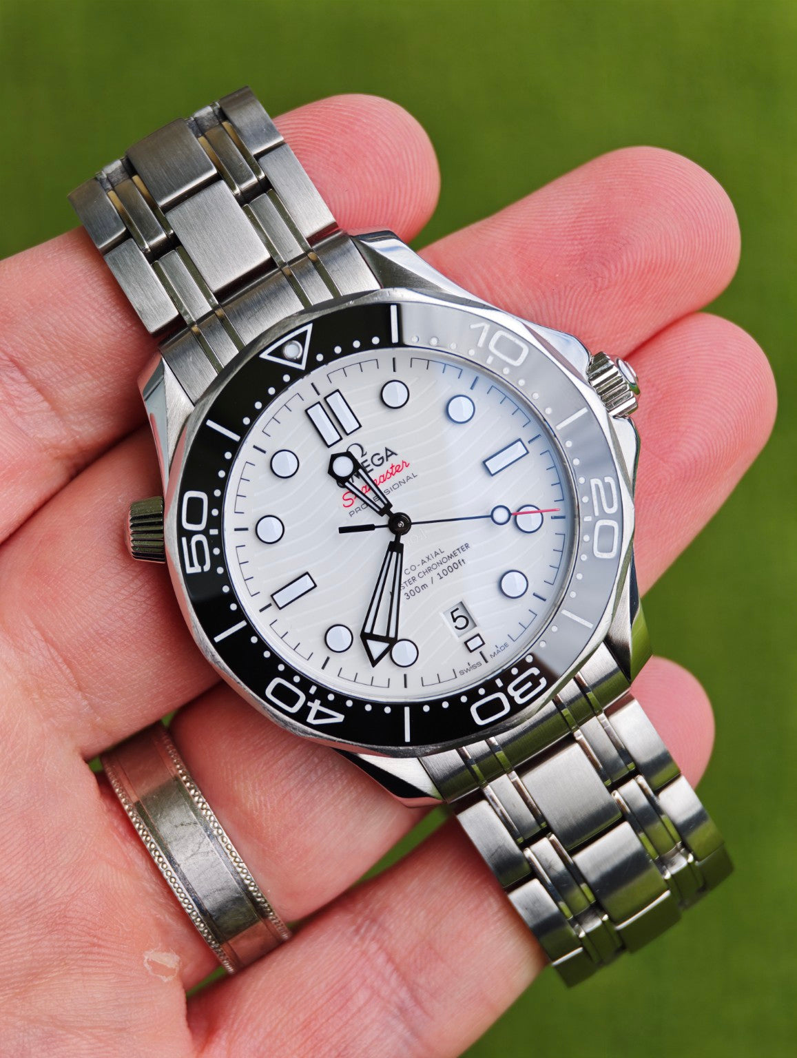 Omega Seamaster Diver 300M white wave dial, black ceramic bezel and stainless steel bracelet